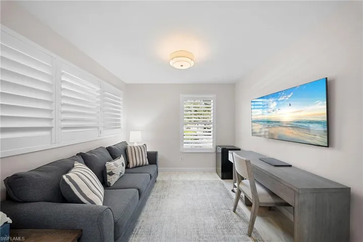 Den with plantation shutters