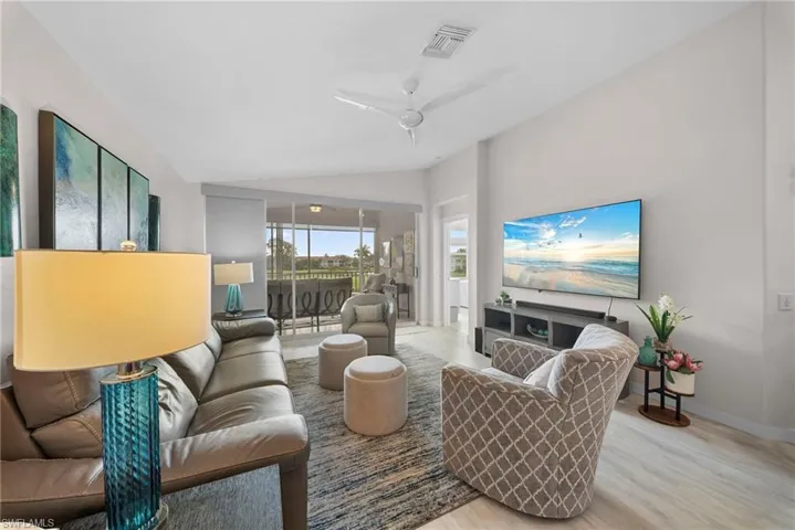 Open living room with golf course view