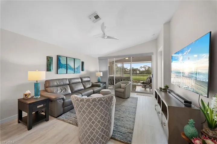 Open living room with golf course view