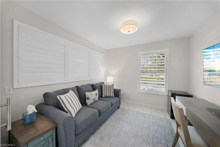 Den with plantation shutters