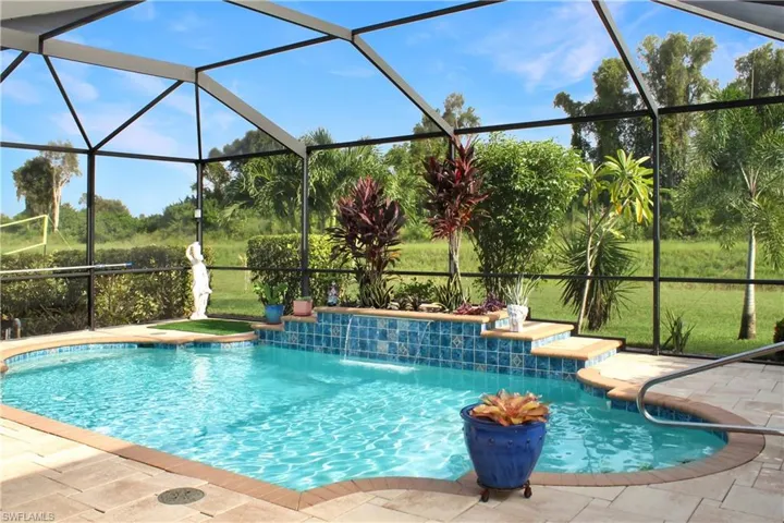Saltwater pool with custom pool planter and fountain