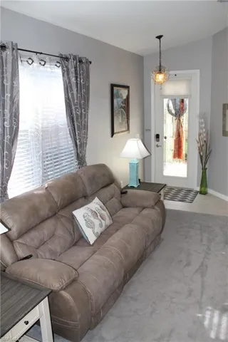 Living room featuring upgraded carpet