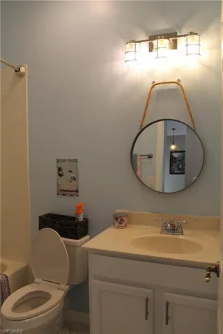 Freshly painted full hallway bathroom with tub/shower, toilet, and vanity