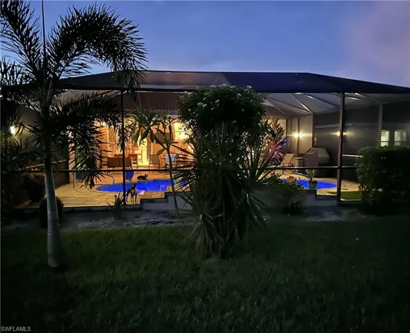 Rear view of house at dusk