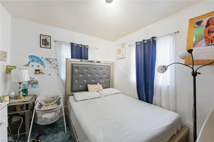 Bedroom featuring multiple windows