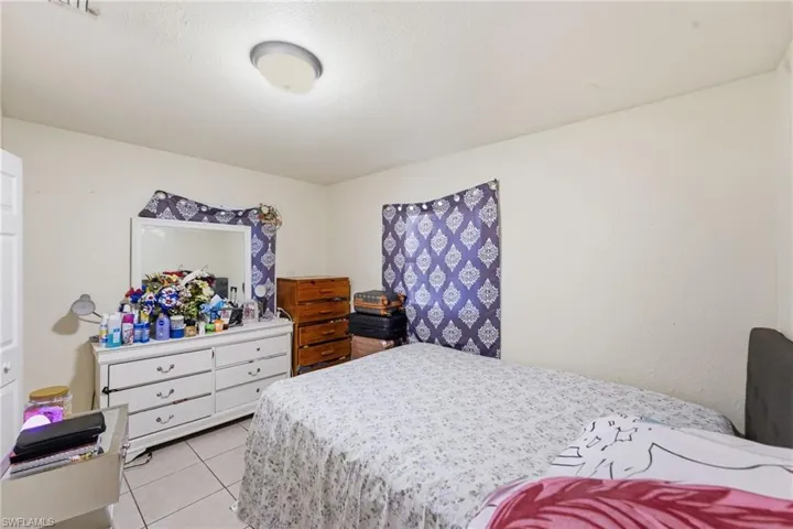 Bedroom featuring light tile patterned floors