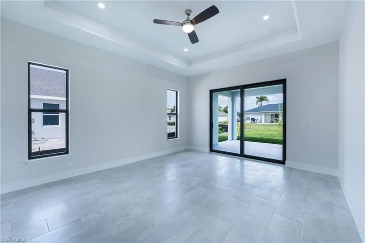 Empty room featuring ceiling fan and recessed lighting