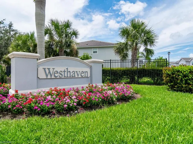Community sign featuring a lawn