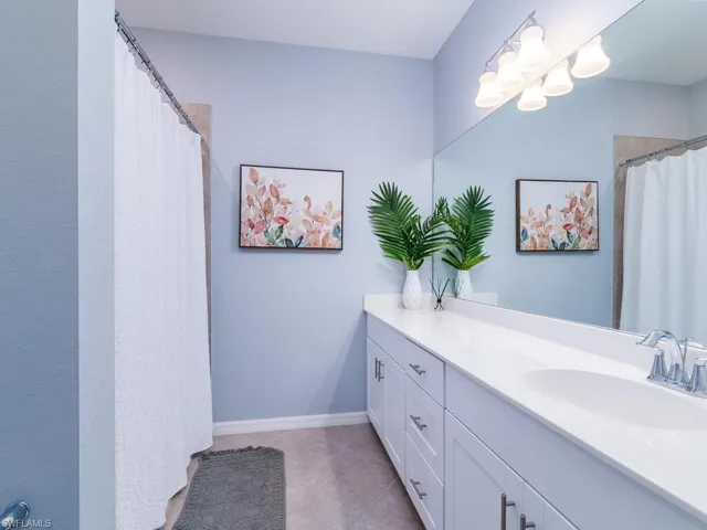 Bathroom with tile flooring and vanity
