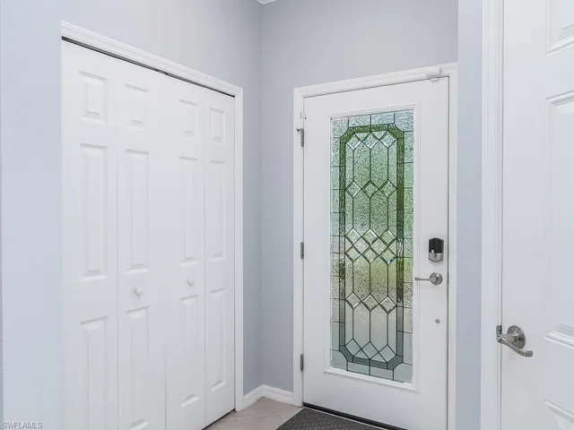 Foyer entrance featuring tile floors