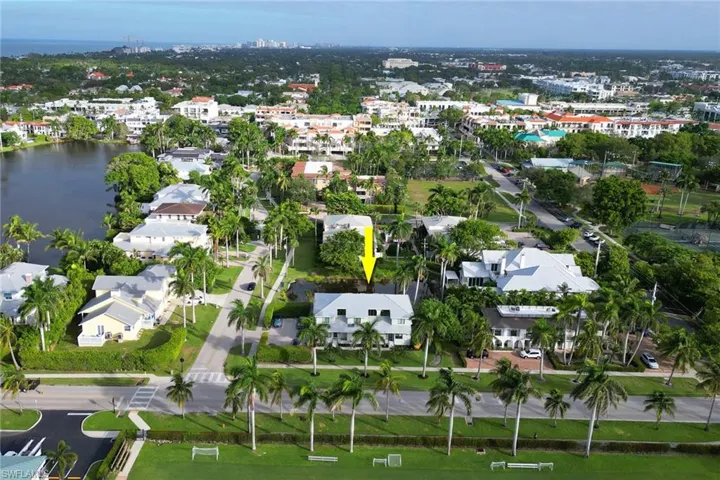 Aerial overview of property's location with a large body of water and nearby urban area