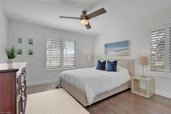 Bedroom featuring light wood-type flooring and ceiling fan