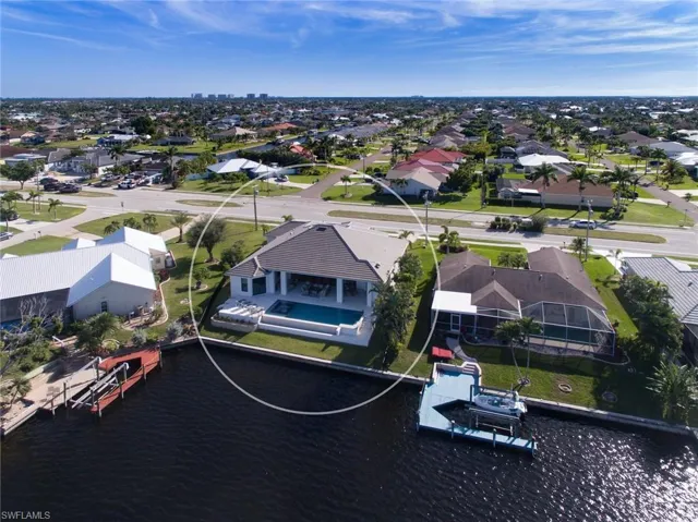 Aerial perspective of suburban area with a nearby body of water
