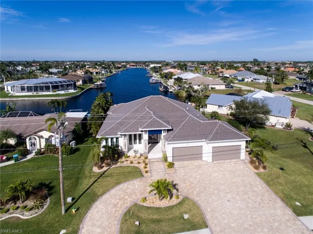 Aerial view of residential area with a nearby body of water