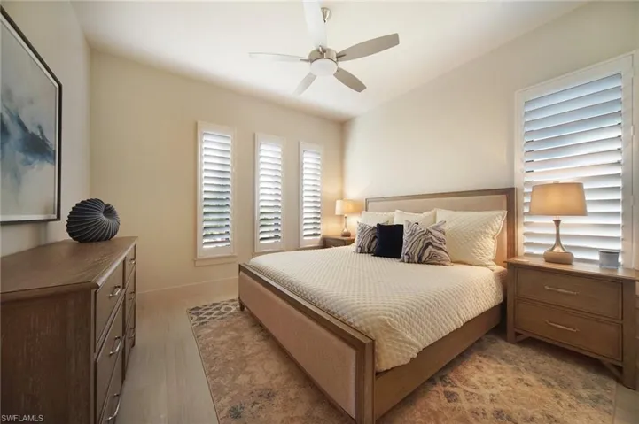 Bedroom featuring ceiling fan and baseboards