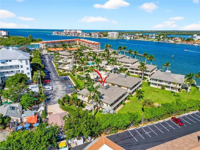 Bird's eye view of a large body of water and apartment complex / building