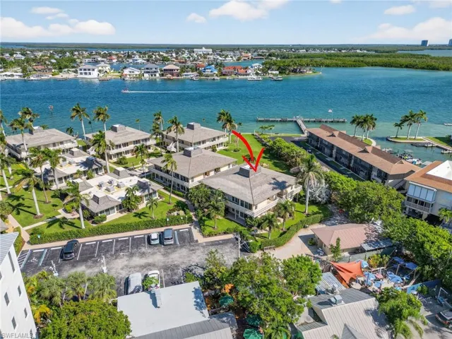 Aerial view of residential area featuring a large body of water