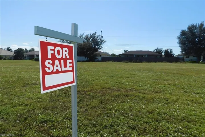 vacant lot with ai modified FOR Sale sign