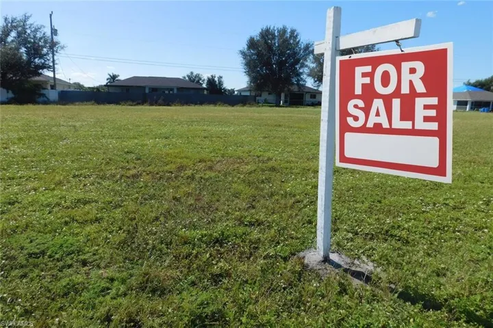Exteriovacant lot with ai modified FOR Sale signr view