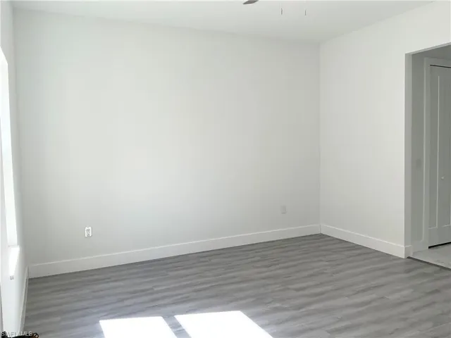 Empty room featuring wood finished floors