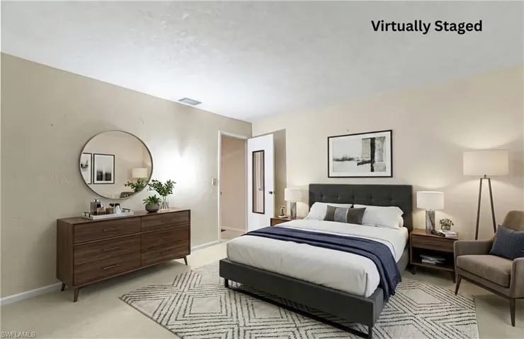 Bedroom with light carpet and baseboards