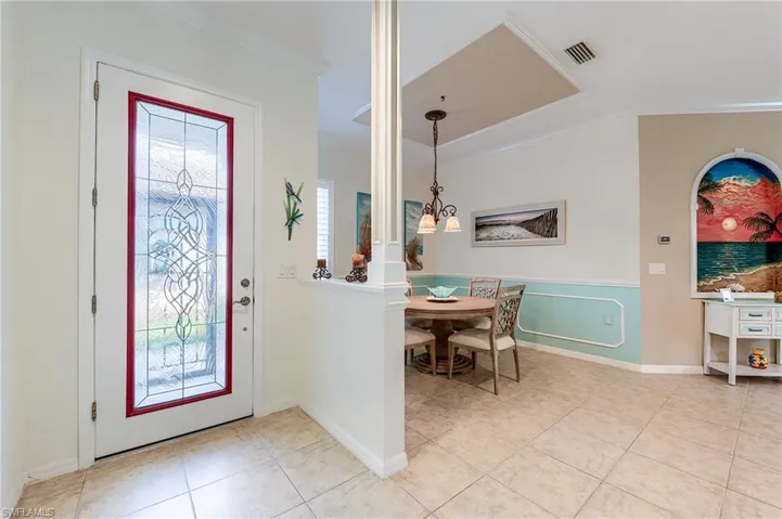 Tiled entry and dining area