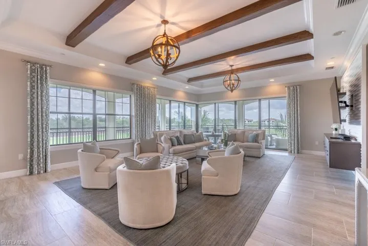 wood beams and designer light fixtures and window treatments