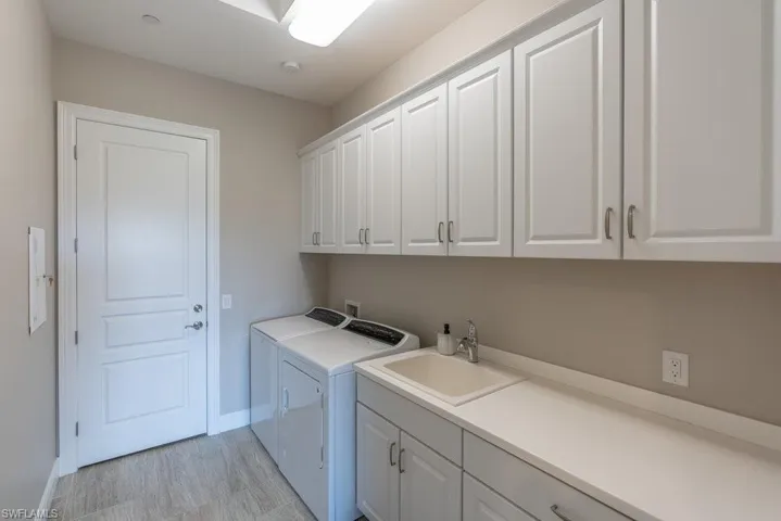 Laundry room with utility tub