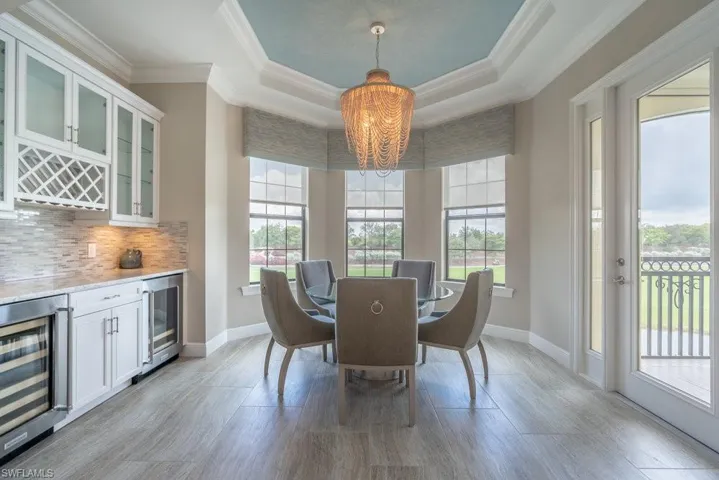 Formal dining and dry bar with wine and beverage cooler