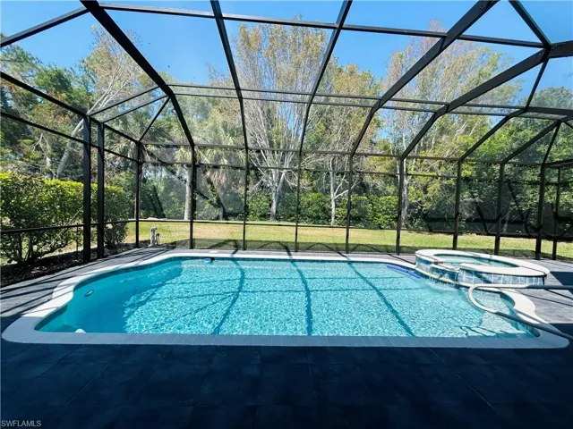Large swimming pool with spa was built by Nassau Pools & has the Aqualink system. Pool cage had $12,000.00 upgrade to bring it up to Hurricane code just done in 2024.