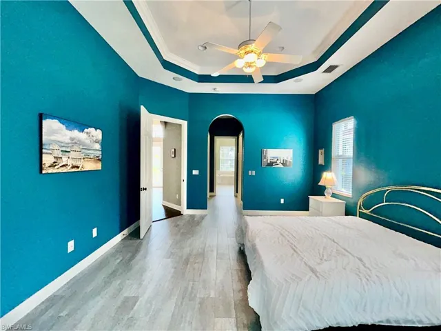 View from master bedroom, sliding door, looking through the bedroom toward the bathroom. Master bedroom flooring is tile because it leads to the swimming pool and spa.