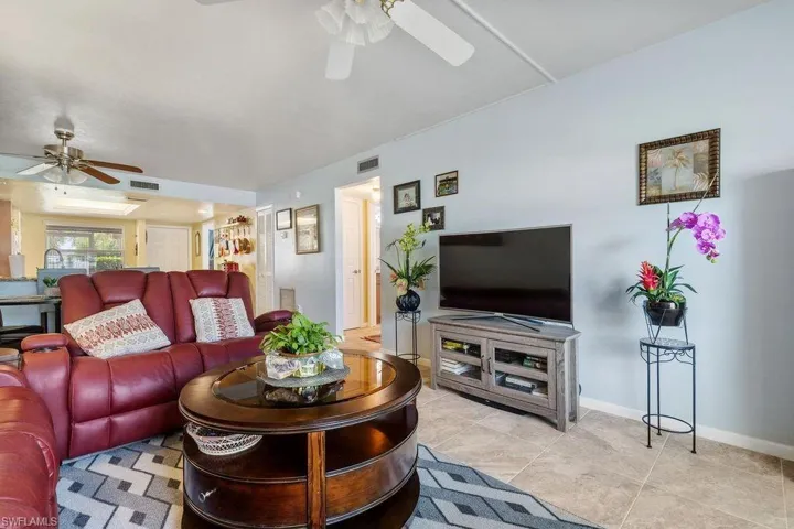 Tiled living room with ceiling fan