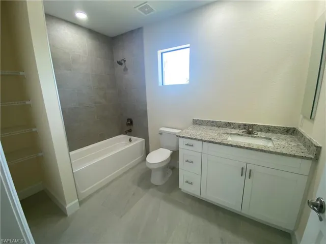 Full bathroom with vanity and shower / bath combination