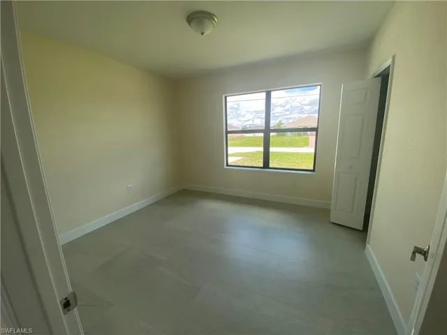 Empty room with baseboards