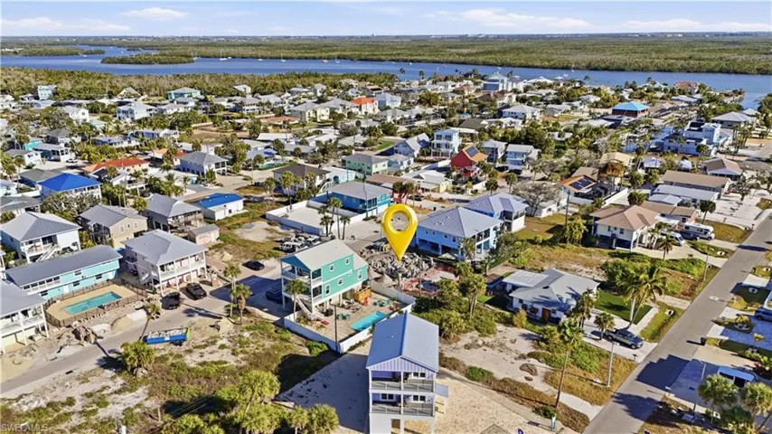 Aerial perspective of suburban area with a large body of water - Virtually Edited Image