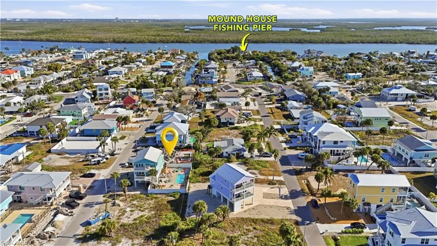 View of property location featuring nearby suburban area and a nearby body of water - Virtually Edited Image