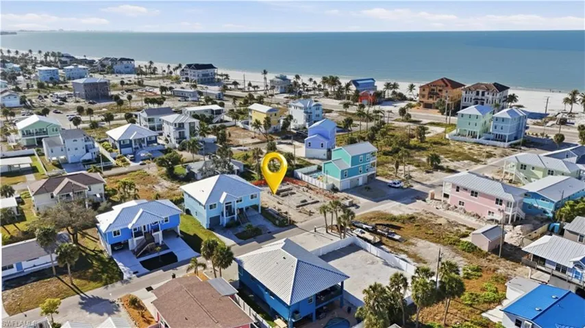 Aerial perspective of suburban area featuring a nearby body of water - Virtually Edited Image
