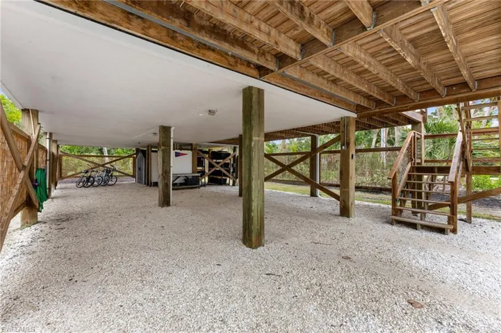 View of patio featuring stairs and an outdoor structure