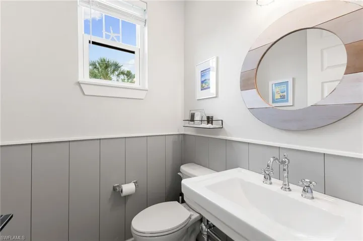 Half bath with a sink and toilet