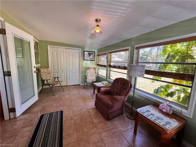 Sunroom with vaulted ceiling