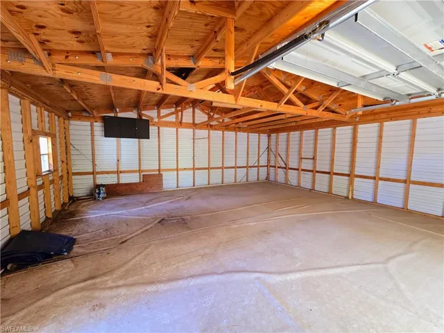 Garage featuring metal wall