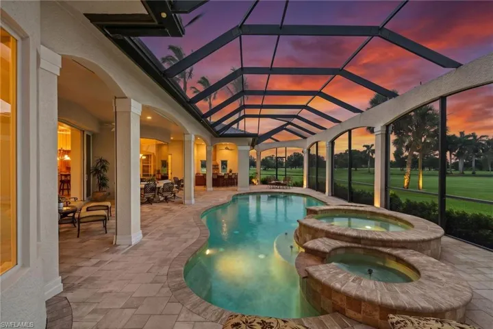 Resort-style saltwater pool and spa framed by an expansive covered lanai, sweeping golf course views, and spectacular Southwest Florida sunsets.