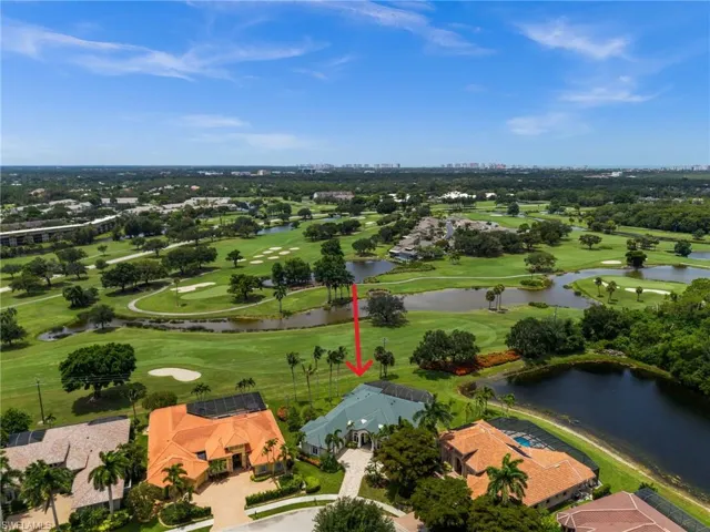Aerial view highlighting the estate’s expansive private lot and sweeping golf course and lake vistas within Castlewood.
