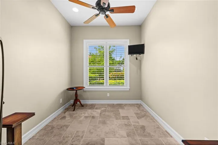 Versatile bonus room offering flexible space for a home gym, hobby room, or custom wine cellar.
