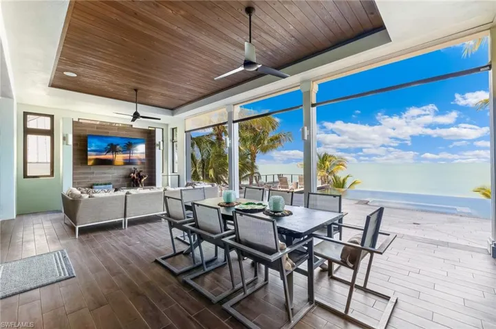 Spacious outdoor lanai with seating, outdoor dining