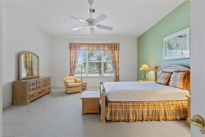 Bedroom featuring carpet flooring and a ceiling fan