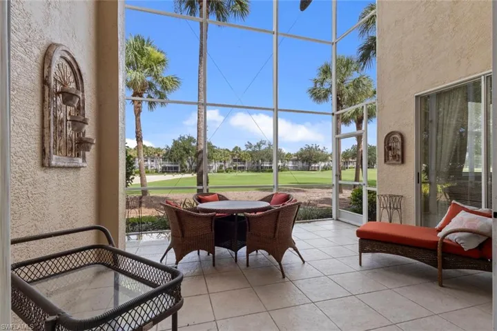 Sunroom featuring golf course view