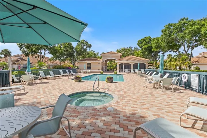 Community pool with a community hot tub and a patio area