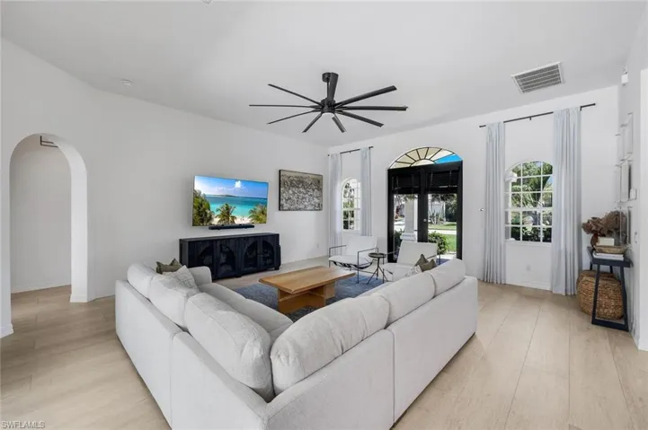 Bright living space featuring light wood-finish flooring