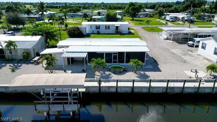 Aerial view of residential area with boat lift on the canal with direct Gulf Access